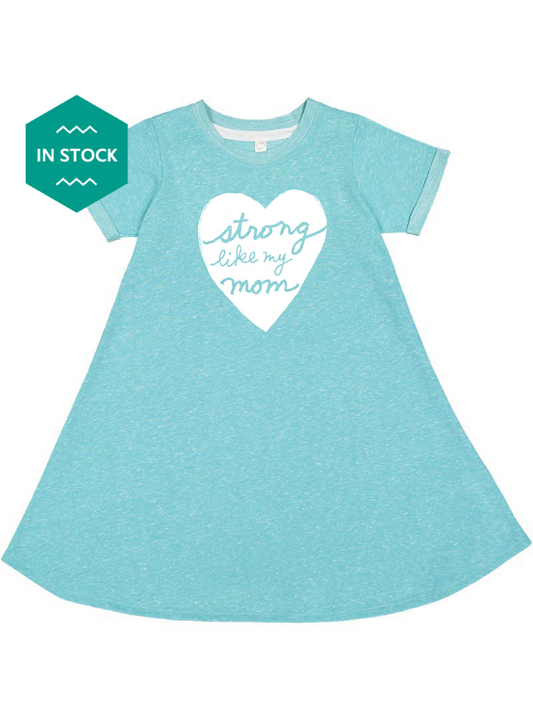 a little girl wearing a blue dress with a heart on it