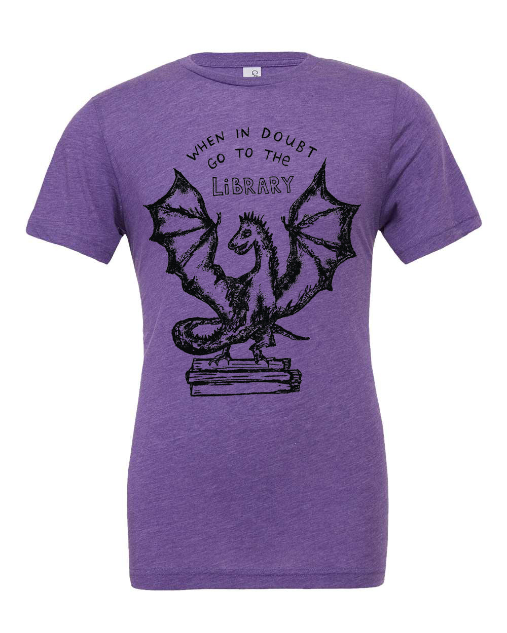 A purple t-shirt with a graphic design depicting a dragon holding a book, accompanied by the text "WHEN IN DOUBT GO TO THE LIBRARY".