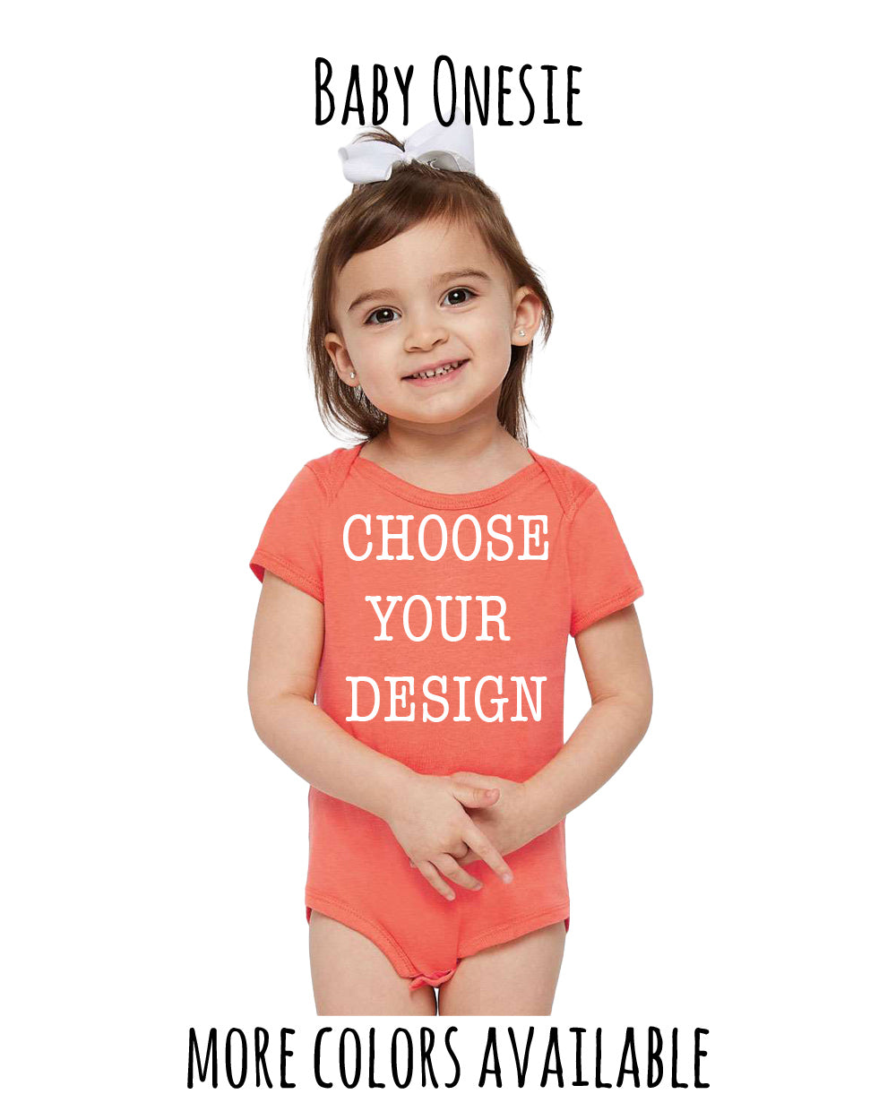 A young girl wearing a bright orange onesie with the text "Choose your design" printed on it, smiling at the camera.