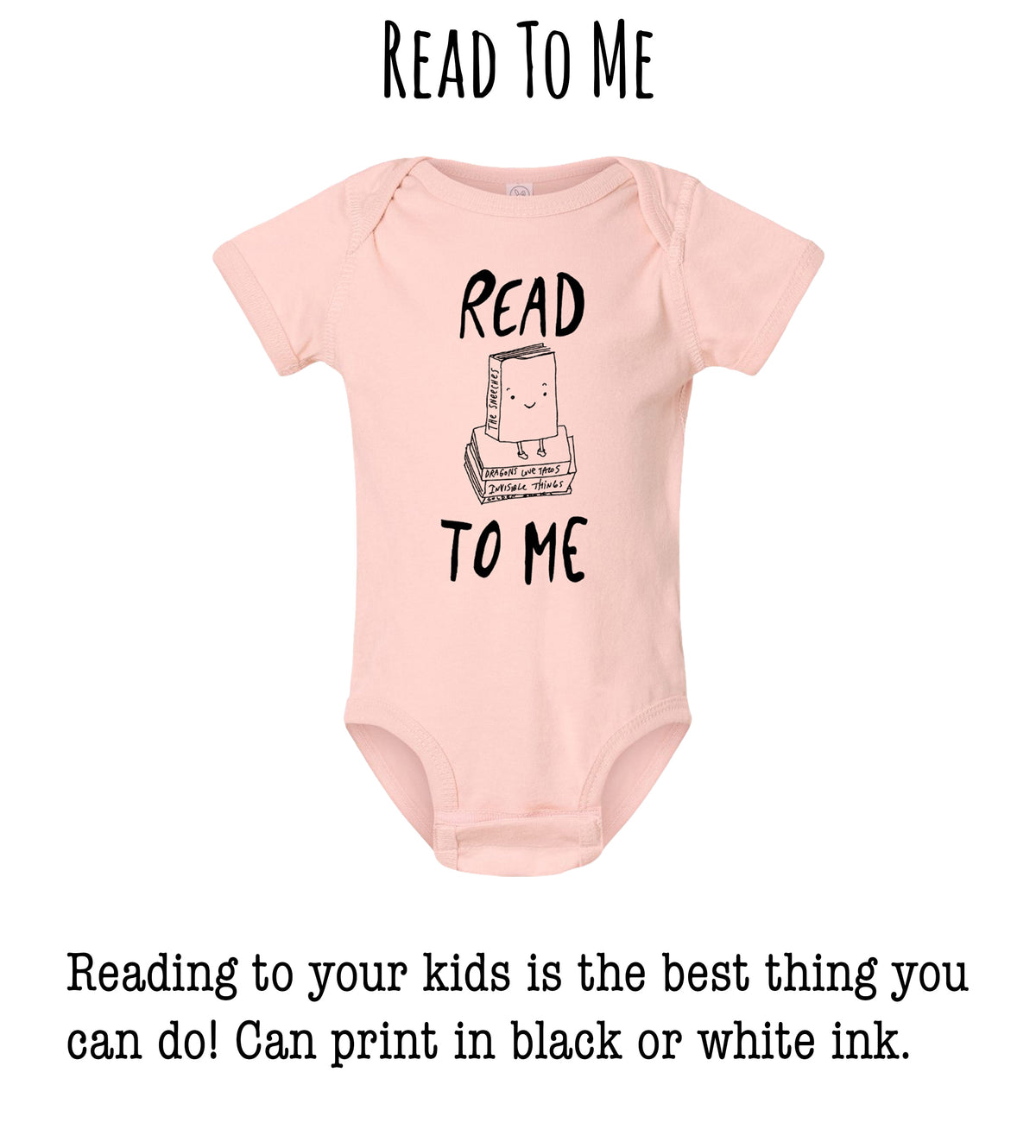 A pink onesie with the text "READ TO ME" printed on it, along with a small illustration of a book.