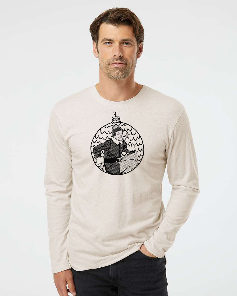 A man wearing a long-sleeved t-shirt with a graphic design of a person in a hat and coat.