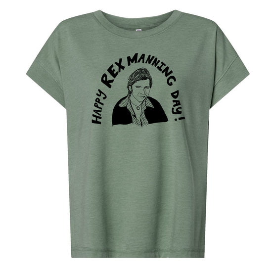 A green t-shirt with a graphic design featuring a man's face and the text "Happy Rex Manning Day!"