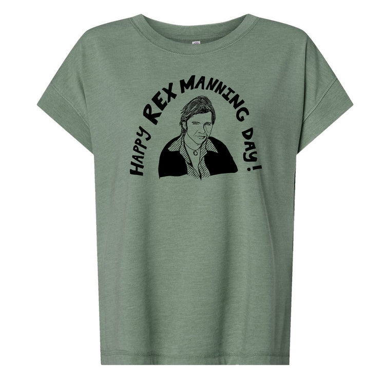 A green t-shirt with a graphic design featuring a man's face and the text "Happy Rex Manning Day!"
