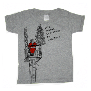 A gray t-shirt with a graphic design depicting Santa Claus on a platform, with the text "It's always Christmas in Oak Park" printed on it.