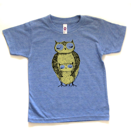 A blue t-shirt with a graphic of two owls, one larger and one smaller, sitting together.