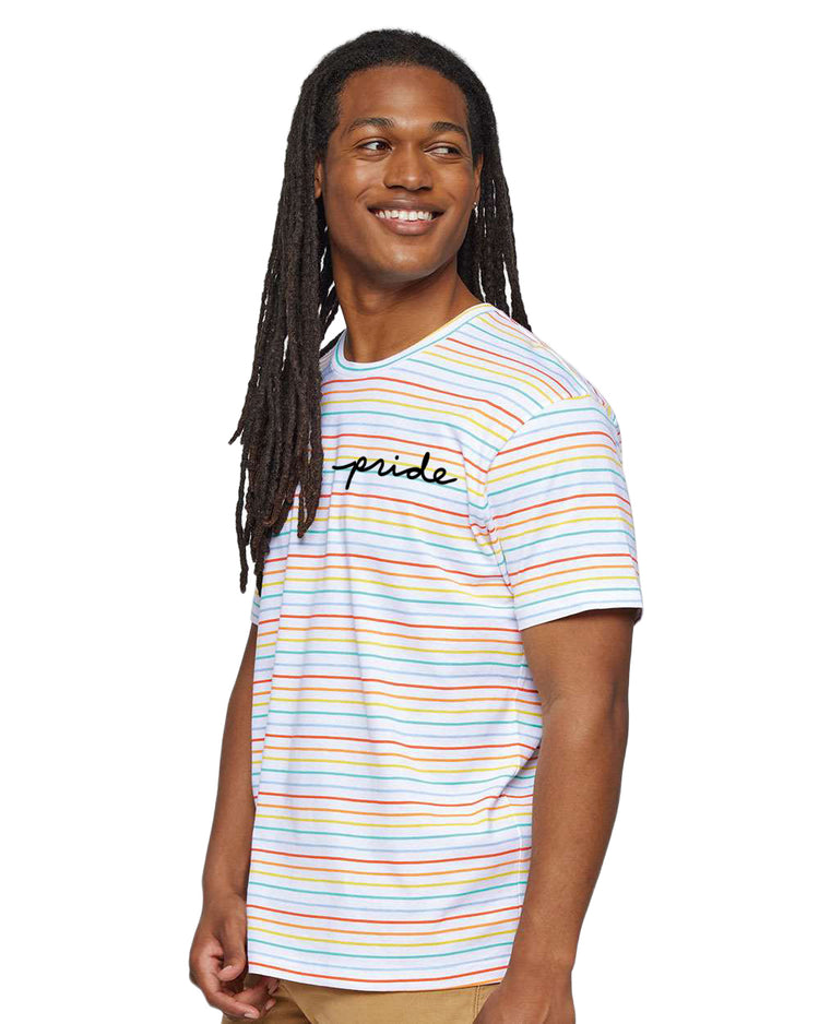 A smiling man with dreadlocks wearing a striped t-shirt with the word "pride" printed on it.