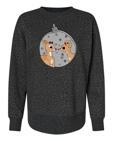 A black sweater with a graphic design featuring two cartoon reindeer inside a snow globe.