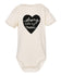 A cream-colored baby onesie with a black heart-shaped graphic and the text "Strong like my mom" printed on it.