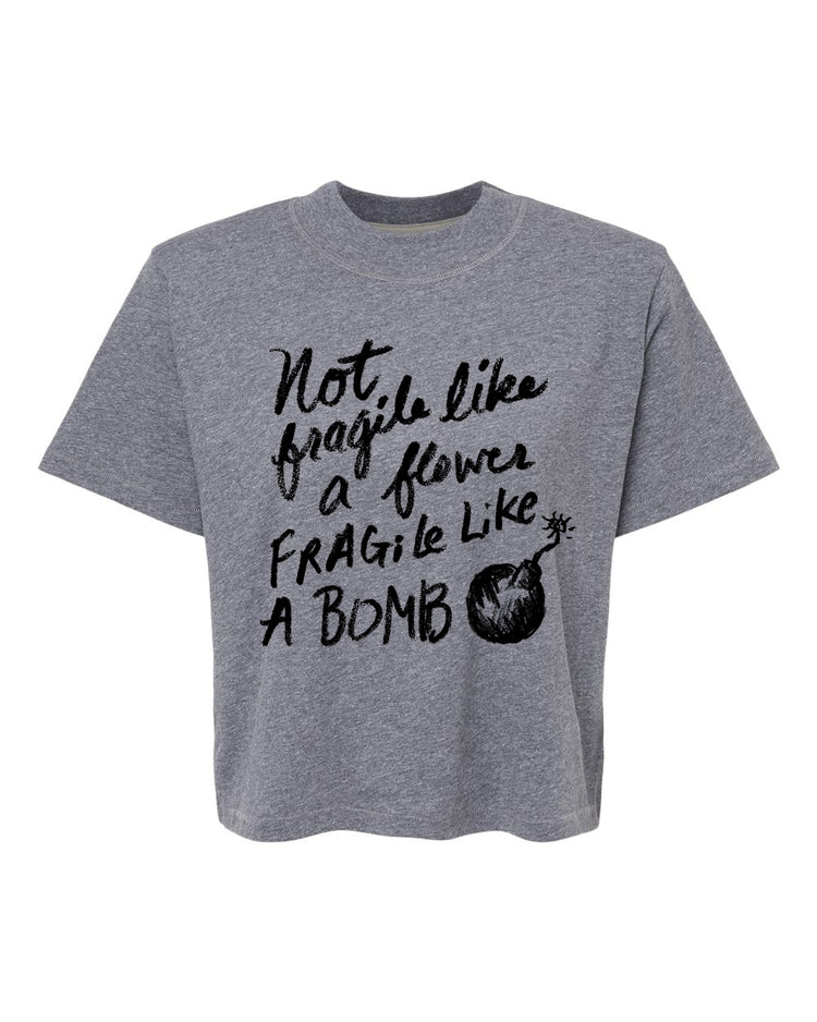 A gray t-shirt with a printed text design that reads "Not, like, fragile like, fragile like a bomb".