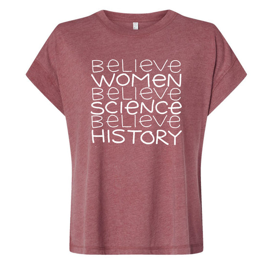 A maroon t-shirt with the text "Believe Women Believe Science Believe History" printed on it in white lettering.