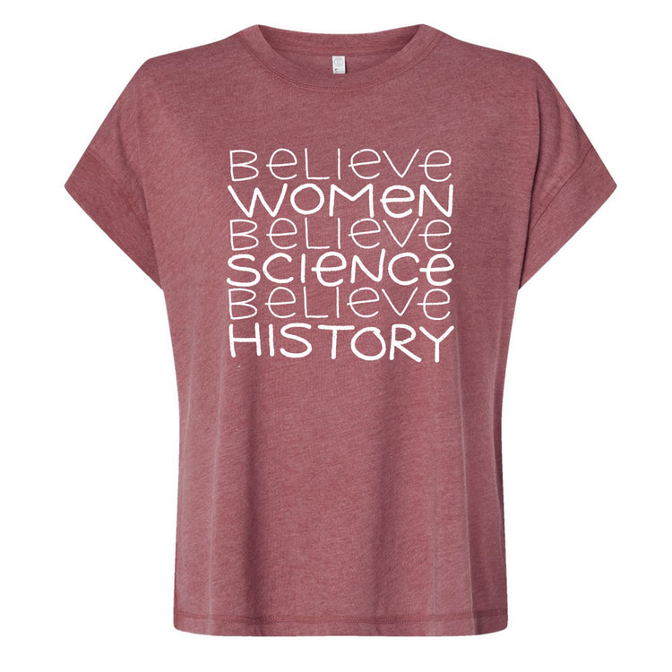 A maroon t-shirt with the text "Believe Women Believe Science Believe History" printed on it in white lettering.