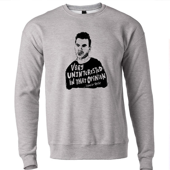 A gray sweatshirt with a black and white graphic of a man's face and the text "Very Uninterested in That Opinion" printed on it.
