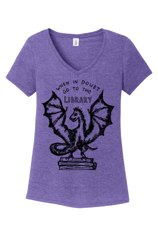 a women's purple t - shirt with an image of a dragon on it