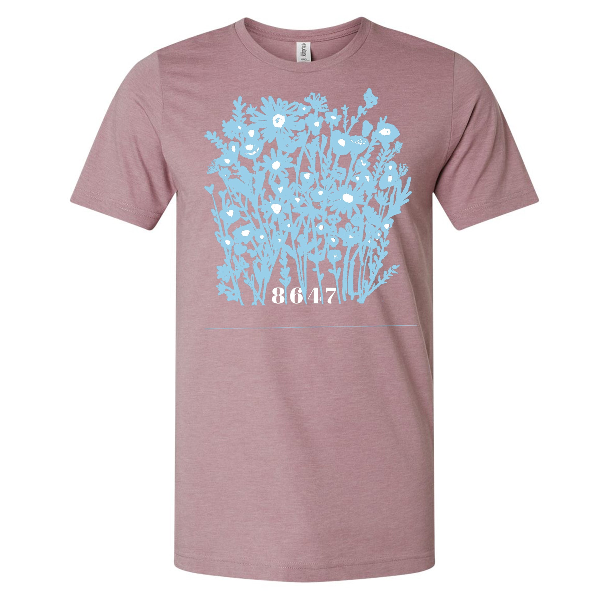 A pink t-shirt with a graphic design depicting a blue floral pattern.