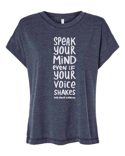 A gray t-shirt with a white text design that reads "SPEAK YOUR MIND even if YOU VOICE SHAKES RUTH GINGBS" printed on it.