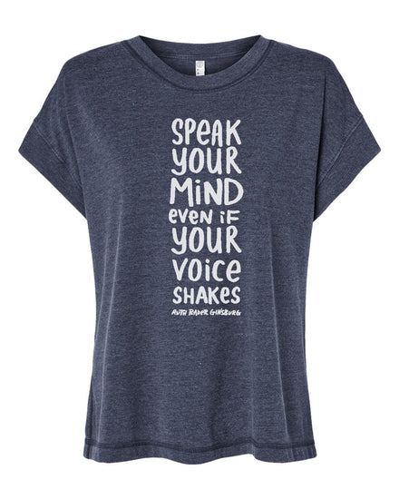 A gray t-shirt with a white text design that reads "SPEAK YOUR MIND even if YOU VOICE SHAKES RUTH GINGBS" printed on it.