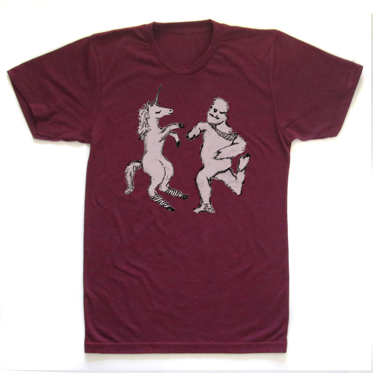 A burgundy-colored t-shirt with a graphic design depicting a unicorn and a creature resembling a Sasquatch or similar mythical being.