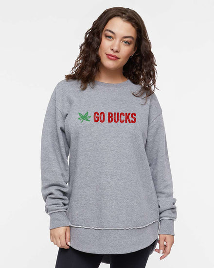 A young woman with curly brown hair wearing a gray sweatshirt with the text "GO BUCKS" printed on it.
