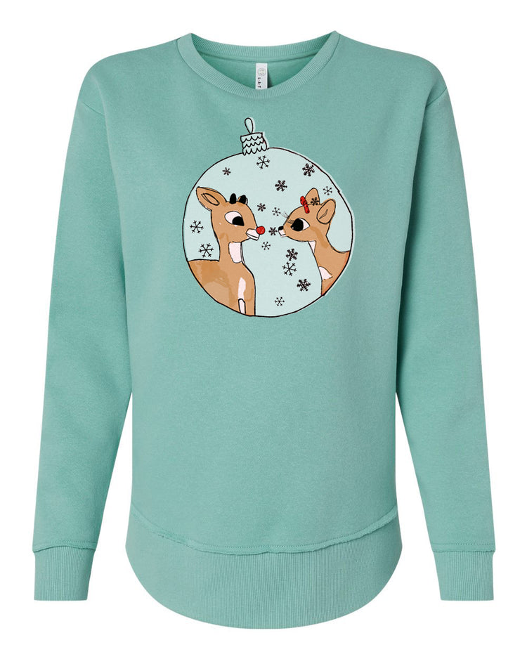 A turquoise sweatshirt with a graphic design featuring two cartoon reindeer inside a snow globe.