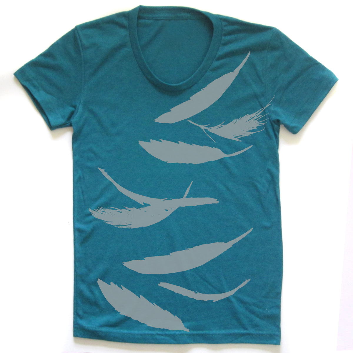 A teal-colored t-shirt with a graphic design of white feather silhouettes printed on it.