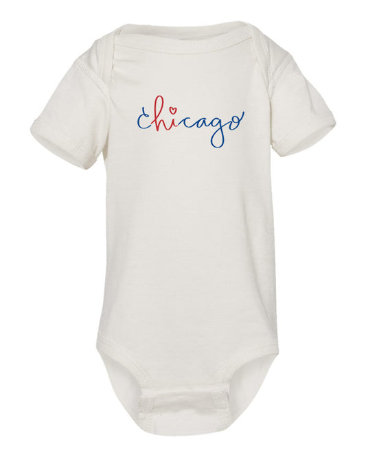 A white baby onesie with the word "Chicago" written in blue cursive text across the front.