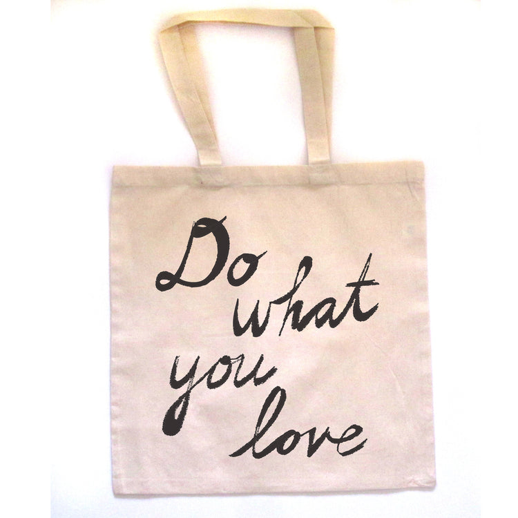 a beige tote bag with the phrase "Do what you love" printed on it in black cursive text.