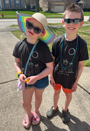 two young children wearing sun glasses and hats