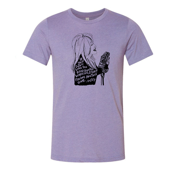 a graphic design on a purple t-shirt depicting a woman with long hair and a microphone.