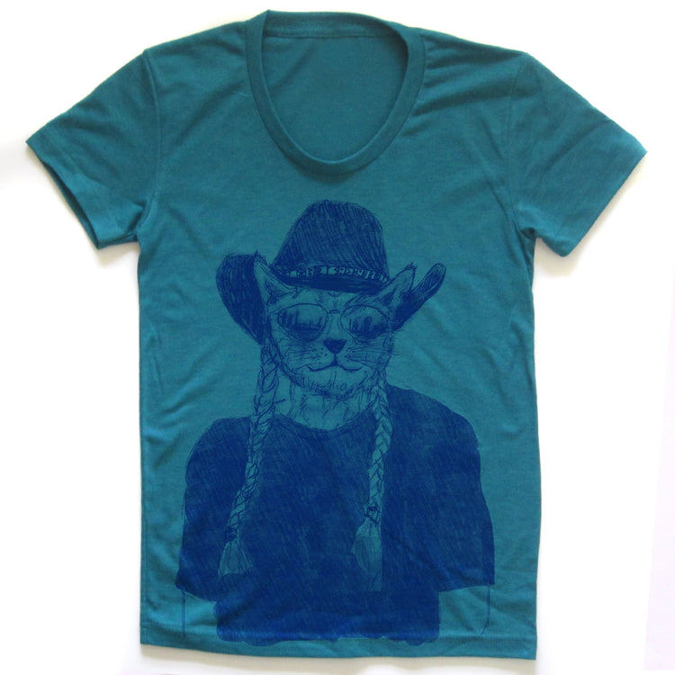 A teal-colored t-shirt with a graphic design depicting a cat wearing a cowboy hat and sunglasses.
