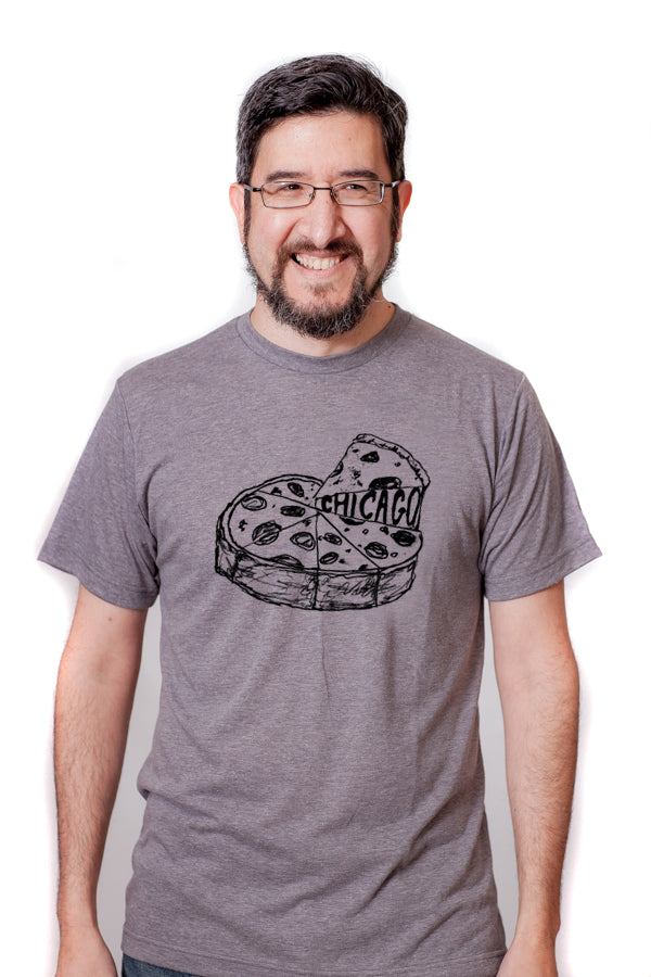 A man wearing a gray t-shirt with a graphic of a pizza and the word "CHICAGO" printed on it, smiling at the camera.