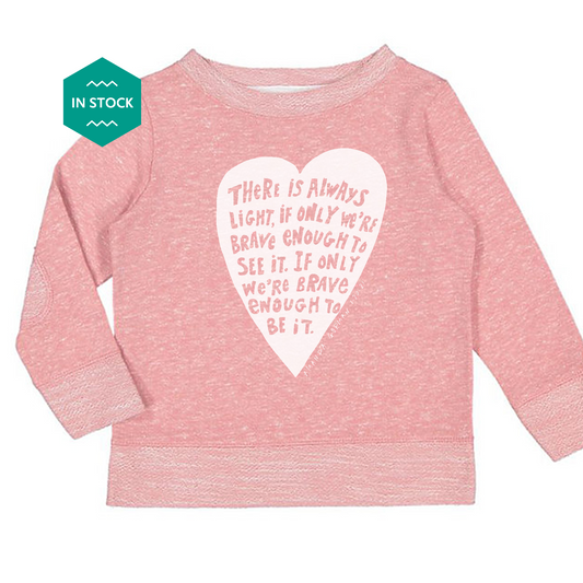 a pink sweater with a heart on it