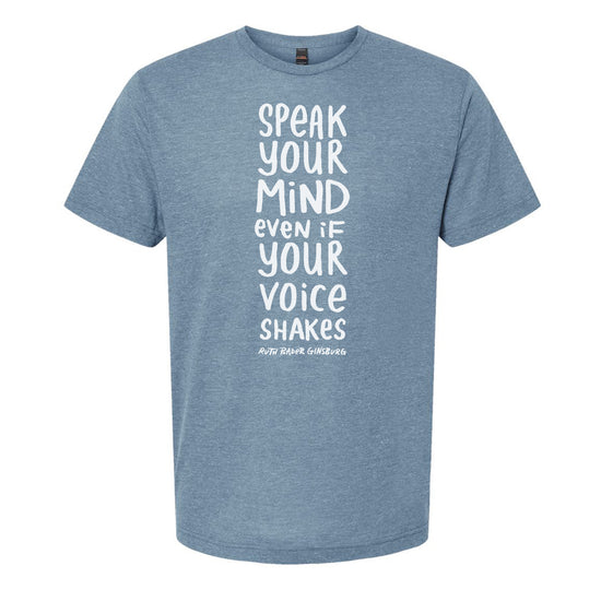 A light blue t-shirt with white text printed on it. The text reads "Speak your mind even if your voice shakes".