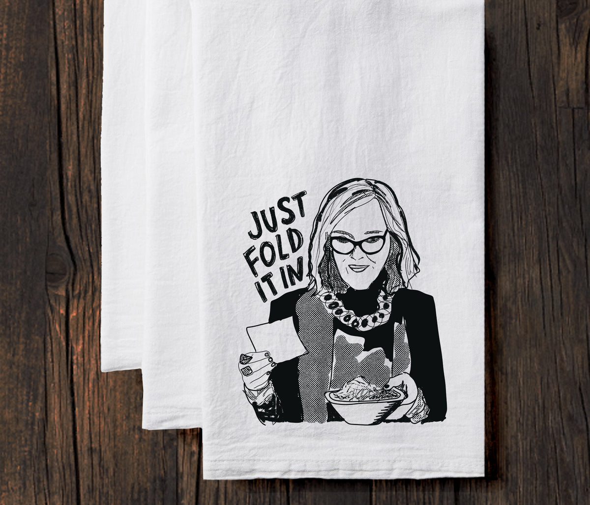 A black and white illustration of a woman holding a bowl of food, with the text "JUST FOLD IT IN" written above her.