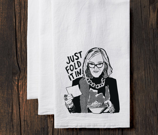 A black and white illustration of a woman holding a bowl of food, with the text "JUST FOLD IT IN" written above her.