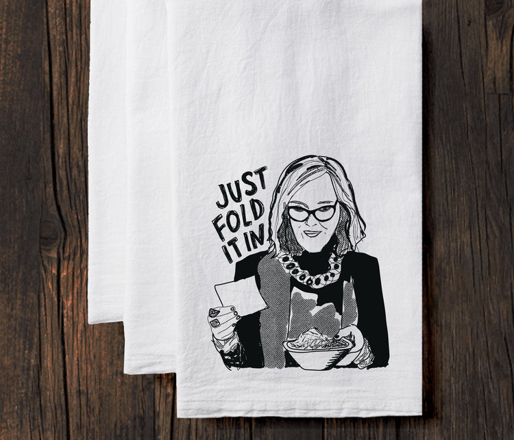 A black and white illustration of a woman holding a bowl of food, with the text "JUST FOLD IT IN" written above her.