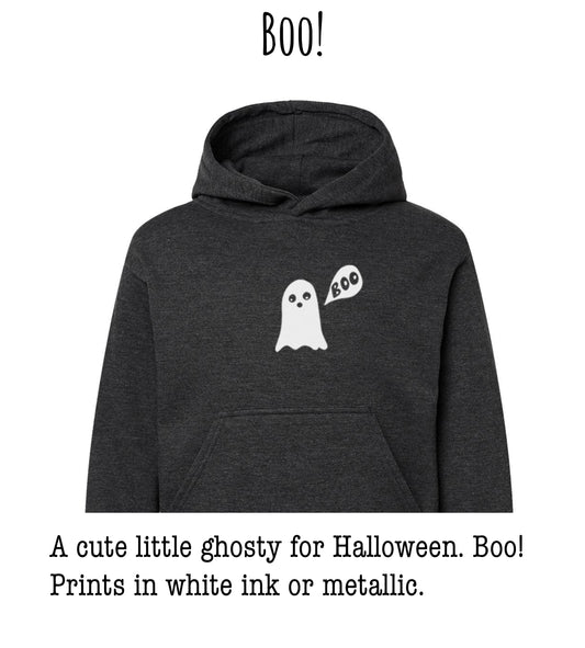 A cute little ghostly figure with the word "BOO!" printed on a dark grey hoodie.
