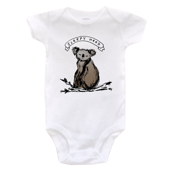 A white baby onesie with a graphic of a koala bear and the text "SLEEPY HEAD" printed on it.