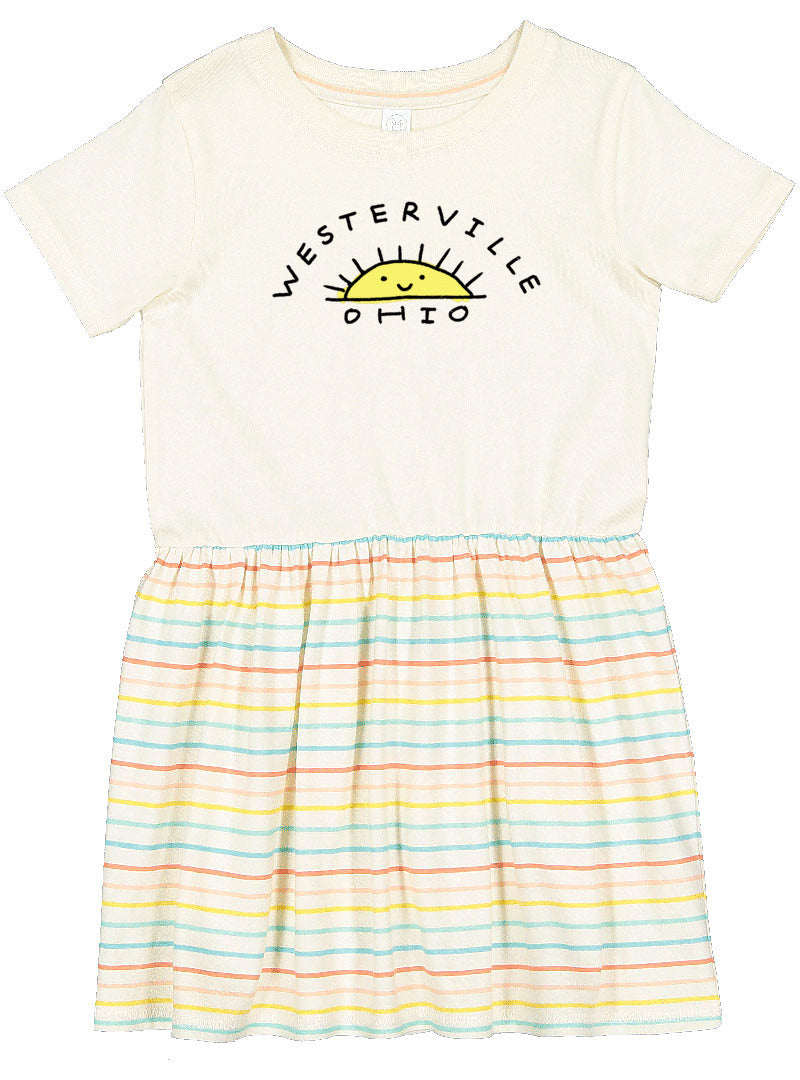 A white t-shirt with a graphic design and a striped skirt.