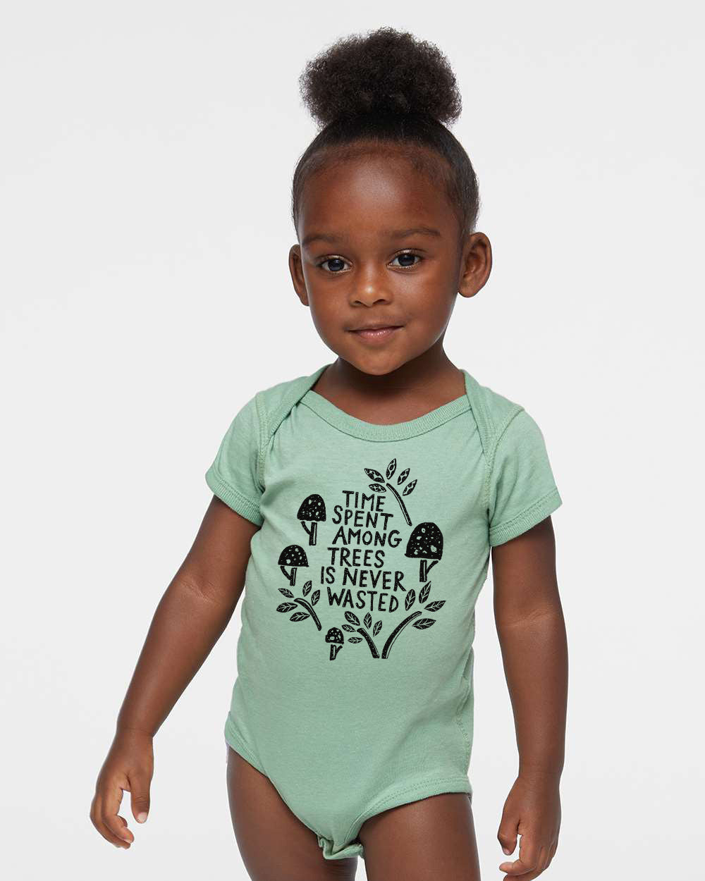 a little girl that is wearing a bodysuit