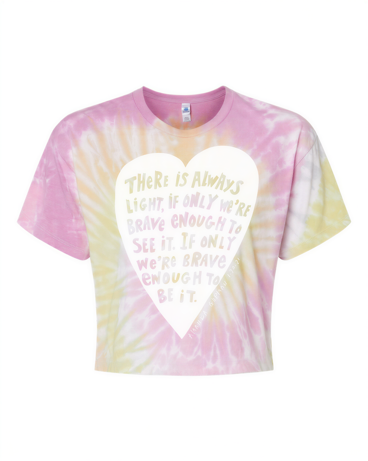 a tie-dye t-shirt with a heart-shaped design containing a motivational quote.
