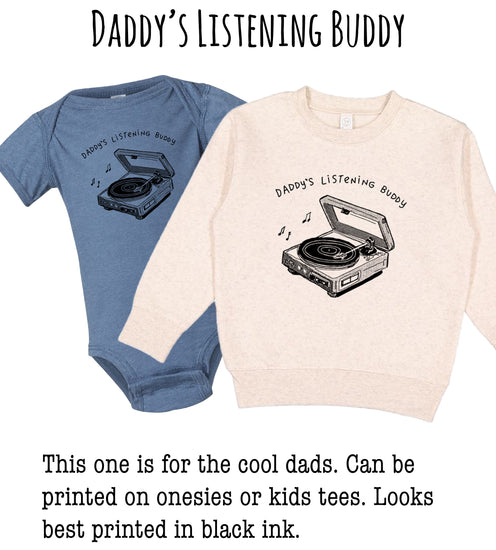 two children's sweatshirts with a design of a record player and the text "DADDA'S LISTENING BUDDY". The sweatshirt on the left is a blue one, and the one on the right is a beige one. The text indicates that this one is for the cool dad and can be printed on onesies or kids tees.