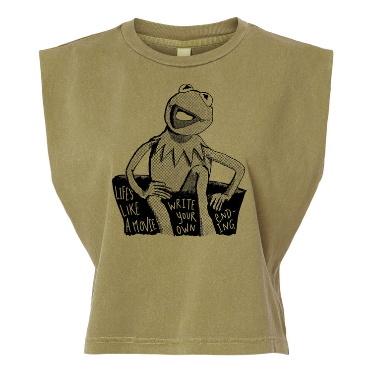 A t-shirt with a graphic design featuring a frog character and text that reads "Lives like a movie, write your own, ending -ing".