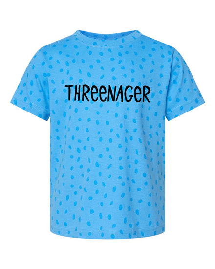 A blue t-shirt with a polka dot pattern and the text "THREEENAGER" printed on it.