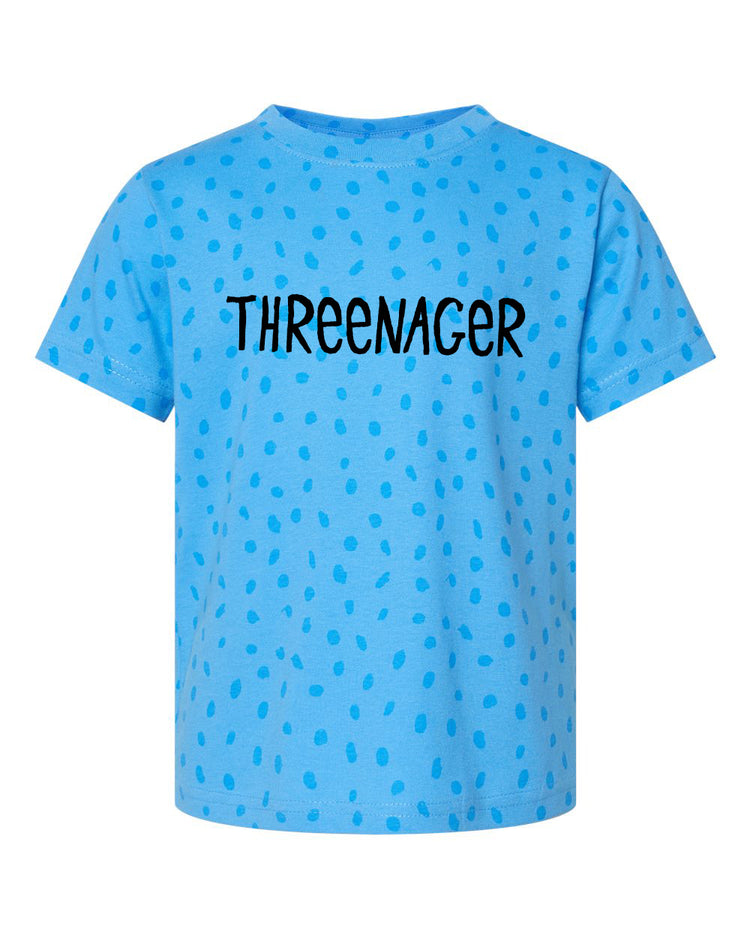 A blue t-shirt with a polka dot pattern and the text "THREEENAGER" printed on it.