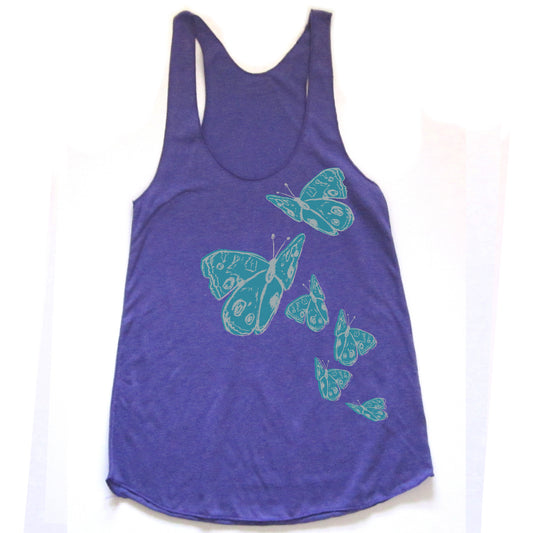 A purple tank top with a design of green butterflies printed on it.