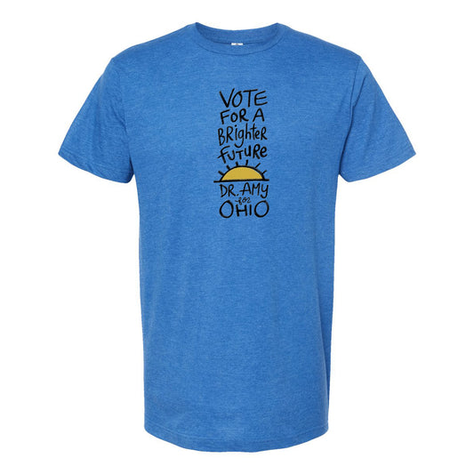 A blue t-shirt with a graphic design featuring text and a sun-like symbol.