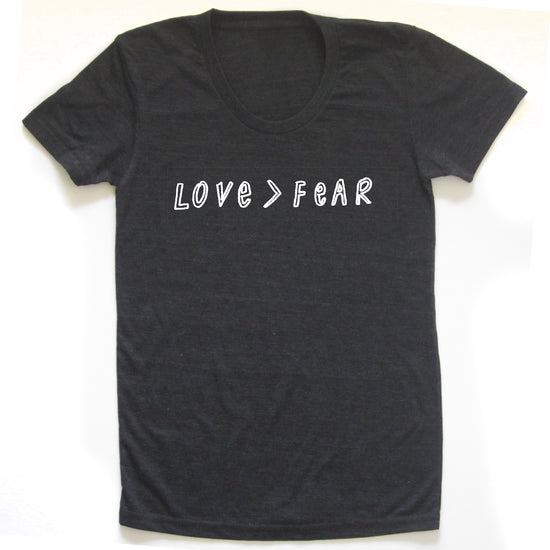 A black t-shirt with the text "LOVE=FEAR" printed on it in white letters.