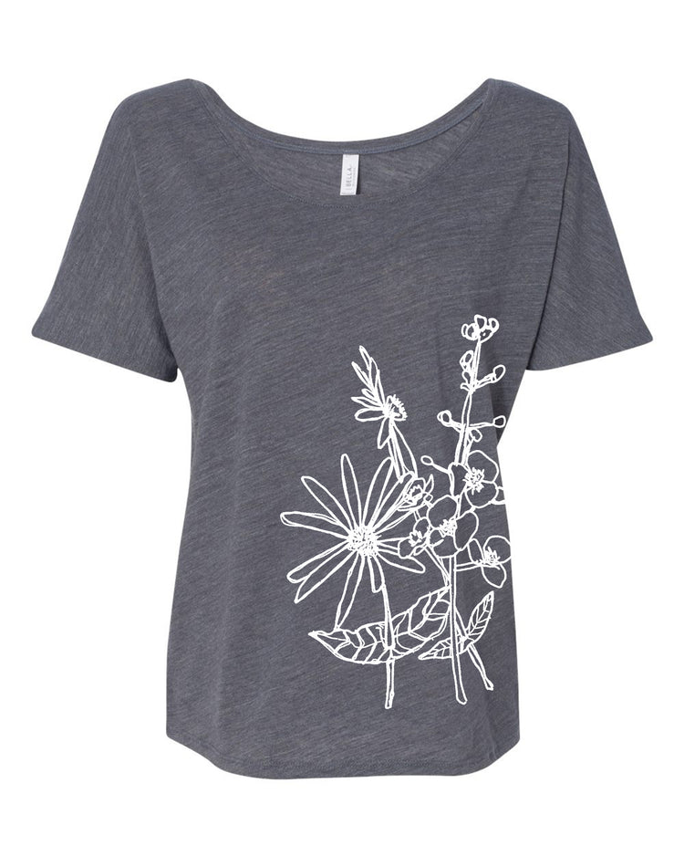 A gray t-shirt with a white floral design on the left side.