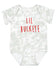 A gray and white tie-dye baby onesie with the text "LIL BUCKEYE" printed on it.