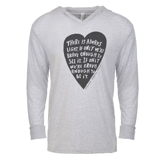 a gray hoodie with a black heart-shaped graphic and white text printed on it.
